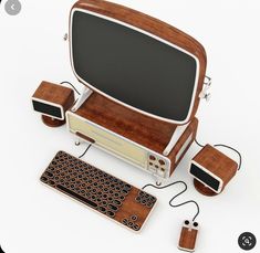 an old fashioned computer with wooden components and accessories on the side, including a keyboard and mouse