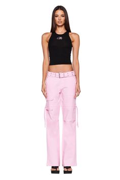 Details Best-selling Naima Cargo Pant is back Baby pink denim jean - Cargo pant style Low-rise waist and relaxed silhouette Double studded belt with silver buckle and eyelets Workable pockets throughout the front and back Featuring workable drawstring at thigh Unlined - This fabric is not sheer Recommended Underwear: Due to the low-mid rise, we recommend wearing this garment with a seamless low-mid brief Size and Fit True to size. We recommend wearing your standard size Low-rise waist - Sits app Iam Gia, Cargo Pant Style, Low Waist Cargo, Pink Cargo Pants, Cargo Pants Style, Pink Denim, Denim Pants Women, I Am Gia, Studded Belt