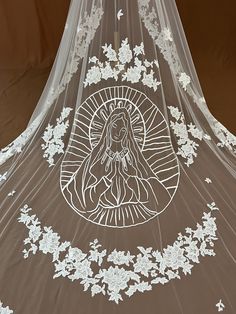 a veil with an image of the virgin mary on it