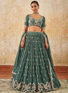 Dusty Green Embroidered Lehenga – Lashkaraa Party Wear Embroidered Lehenga In Raw Silk, Party Wear Sharara With Embroidered Traditional Drape, Festive Embroidered Party Wear Sharara, Silk Embroidered Choli For Party Wear, Party Wear Sets With Zari Work In Chinon, Silk Embroidered Party Wear Choli, Party Wear Embroidered Choli In Chinon, Art Silk Designer Wear Party Sets, Embroidered Chanderi Choli For Party Wear