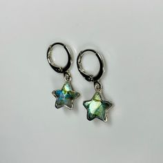 ✵ Listing is for one pair of handmade earrings ✵10 x 10mm Labradorite  ✵Silver-plated charm ✵12mm x 14mm Rhodium-plated non- tarnish earrings ✵Lever-back small hoops ✵Please note: these gemstones are natural, therefore, will be unique in size, color, and texture. However, I will do my best to find pair up the most similar stones ✵Packaged in gold tissue paper with recyclable earring card holders, receipt included upon request  ✵Dainty, classy, and minimalistic style Get the set! Necklace link do Star Celestial, Gold Tissue Paper, Huggie Earrings Silver, Star Silver, Earring Card, Mia 3, Tiny Star, Dope Jewelry, Crystal Stars