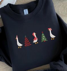 Christmas Goose Sweatshirt Embroidered, Santas Goose Crewneck, Funny Animal Sweatshirt, Farm Lover Gift, Goose Lover Gift, MADE IN USA There are two brands we use: Gildan and our own brand BeePro Handmade. Comfort Colors, Bella Canvas, and other brands are available upon request at a different price. If interested in adding embroidery to the sleeve please go to this listing: https://www.etsy.com/listing/1674502020 Because it is made to order, we don't accept the return or exchange unless we make Casual Embroidered Christmas Top, Goose Sweatshirt, Funny Goose, Christmas Goose, Animals Christmas, Animal Sweatshirt, Information Processing, Funny Sweatshirts, Shirt For Women