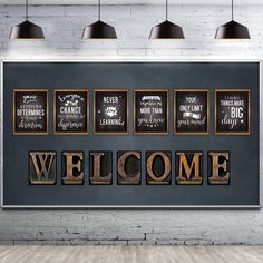 the word welcome written in wooden letters on a black wall with hanging lights and lamps