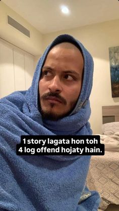 a man wrapped in a blue towel with the caption, 1 story lagatta hon toh 4 log offered holiday ham