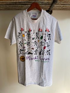 Vintage deadstock Flambeaux Mambo New Orleans Mardi Gras T-shirt. Size medium adult by Hanes Beefy T. Made in the USA. 97% cotton. Single stitch. Small spot faint can be washed Band Merch T-shirt For Fan Merchandise, Deadstock Cotton Crew Neck T-shirt, Crew Neck Cotton T-shirt Deadstock, Cotton Crew Neck T-shirt Deadstock, New Orleans Mardi Gras, Mambo, Made In The Usa, Mardi Gras, New Orleans