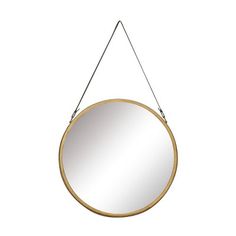 a round mirror hanging from a metal hook