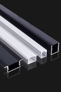 three different types of aluminum profiles on a black background with the same color and size