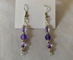 purple glass bead and silver bead dangle earrings Elegant Lavender Beaded Drop Earrings, Silver Wire Wrapped Round Bead Earrings, Purple Round Metal Earrings, Silver Wire Wrapped Earrings With Round Beads, Silver Czech Glass Jewelry With Matching Earrings, Purple Metal Dangle Earrings, Purple Dangle Metal Earrings, Lavender Dangling Beads For Jewelry Making, Sterling Silver Round Bead Crystal Earrings