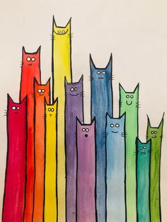 a group of cats that are standing in front of each other on a sheet of paper