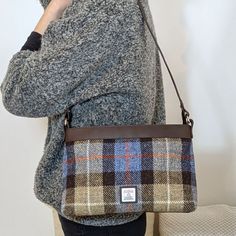 Our Harris Tweed Large Shoulder Bag is a brilliant size with a durable style, that can be used every day. The shoulder bag has one main compartment, secured with a zip. Inside this Harris Tweed bag there are open pockets for phones and essentials as well as a small zip compartment. This bag has a short shoulder strap as well as a longer detachable strap that you can wear across your body. Large Shoulder Bag Dimensions: 20cm x 30cm x 9cm The vegan leather trim colour will differ depending on the Rectangular Tweed Shoulder Bag For Travel, Rectangular Tweed Shoulder Bag For Everyday Use, Rectangular Tweed Shoulder Bag For Everyday, Tweed Satchel Bag For Everyday Use, Fall Tweed Shoulder Bag, Rectangular Shape, Everyday Tweed Crossbody Bag, Fall Tweed Shoulder Bag For Everyday, Rectangular Tweed Shoulder Bag For Fall, Brown Tweed Shoulder Bag For Fall