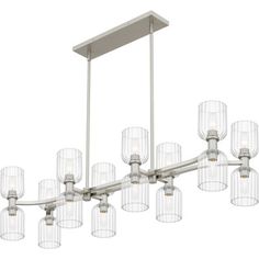 a large chandelier with many lights hanging from it's sides and clear glass shades