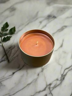 a candle sitting on top of a marble table