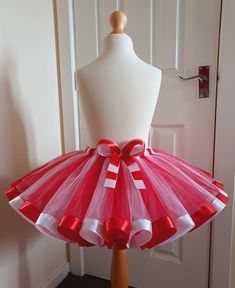 Stunning Red & White Tutu Skirt This fabulous tutu skirt has been made using 2 layers of top quality soft tulle in the colours of Red & White, with a beautiful satin ribbon trim in matching colours & a gorgeous 4 layered bow giving the finishing touch, which every princess would love! Stunning for any occasion All our lovely tutu skirts are made to order PLEASE BE AWARE that shades of tulle & ribbon may slightly differ from those illustrated due to the dying process  Your very welcome to follow Cute Christmas Tutu Dress, Christmas Ruffled Tutu Dress, Red Christmas Tutu Dress, White Tutu Skirt, Red Christmas Tutu Dress For Dress-up, Christmas Tutu Dress, Pink Tutu Skirt, Tulle Skirts Outfit, Girl Tutu Skirt