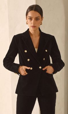 Our classic coat is rendered in a timeless black. The Bryce Coat has an oversized silhouette, so it layers perfectly over chunky knitwear and structured tailoring. Made from a wool blend, it has dropped shoulders, side pockets, and an oversized fit for easy movement. Blazer Velvet Double-Breasted Buttons Length: 26 1/4" Chest: 17 3/4" Self: 100% Polyester Lining: 97% Polyester, 3% Spandex Hand wash in cold water with similar colors. Model is wearing a size small Style #: G248J1683 Classic Coat, Sweater Jumpsuit, Classic Coats, Chunky Knitwear, Velvet Blazer, Trendy Designs, Oversized Silhouette, New Shop, Drop Shoulder