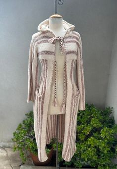 Vintage boho knit duster long cardigan sweater stripes brown beige Sz S/XS International. Made of cotton acrylic blend, good condition with one spot on front ( last photo). Pockets and hood made in Hong Kong.  Measurements  Shoulders 20" Sleeves 21" Bust 36" Waist 30" Hips 40" Length 45" Cozy Long Cotton Sweater, Long Brown Spring Sweater, Bohemian Long Knit Sweater Coat, Cozy Long Cotton Cardigan, Long Brown Cotton Outerwear, Long Beige Cotton Cardigan, Bohemian Brown Long Sleeve Sweater Coat, Brown Long Bohemian Cardigan, Long Brown Bohemian Cardigan