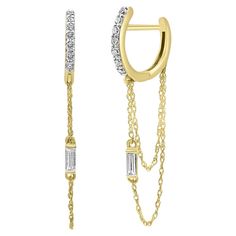 Elegant 18 karat gold earrings with a modern design. Each earring features a row of small diamonds on the front, adding a touch of sparkle. Two fine gold chains dangle from the main hoop, adorned with rectangular diamonds for a luxurious look. Perfect for any occasion, these earrings exude sophistication and style with their gold and diamond combination. Modern Hoop Earrings, White Gold Hoop Earrings, Gold Diamond Hoop Earrings, Thick Hoop Earrings, Gold Chandelier Earrings, White Gold Hoops, 18k Gold Earrings, Long Drop Earrings, Diamond Hoop Earrings