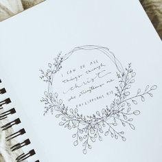 an open notebook with writing on it and a floral wreath around the page that says, i can do all things right now