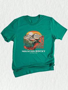 Introducing our stunning Rocky Mountain Group Travel Shirt! ️ Perfect for family trips, this trendy tee combines style with adventure. Designed with love, this National Park inspired shirt features a mesmerizing Rocky Mountain graphic, capturing the awe-inspiring beauty of nature. ‍‍‍ Crafted using premium quality materials, this Mountain Shirt offers both comfort and durability.  Its soft and breathable fabric ensures a cozy fit, while its exceptional stitching guarantees long-lasting wear. Whe Mountain Graphic, National Park Shirt, Mountain Shirt, Detailed Illustration, Travel Shirt, Family Trips, Trendy Mom, Summer Trip, Rocky Mountain National