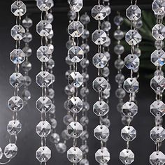 many clear crystal beads hanging from the ceiling