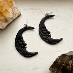 Boho Moon Clay Dangle Earrings, Black Moon Witchy Earrings, Handmade polymer clay earrings Clay boho moon dangle earrings, made from hand sculpted polymer clay. Clay moon dangle earrings Handmade moon clay earrings with face detail.  These clay earrings are created from high quality clay and are nickel free. These earrings are super lightweight! They also make the perfect nature-inspired statement earrings! * Nickel Free * Super Lightweight  * Each pair of earrings is handmade and uniquely desig Handmade Black Moon-shaped Earrings, Handmade Black Moon Earrings, Handmade Black Crescent Earrings, Elegant Black Moon-shaped Earrings, Black Moon Shaped Earrings For Gift, Black Crescent Earrings For Pierced Ears, Black Moon-shaped Earrings For Gift, Black Drop Earrings With Moon Charm, Adjustable Black Crescent Earrings