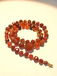 antiques carnelian beads necklace Luxury Carnelian Beaded Necklace With Natural Stones, Luxury Carnelian Gemstone Beads Necklace, Luxury Single Strand Carnelian Beaded Necklace, Luxury Handmade Carnelian Beaded Necklaces, Red Agate Round Bead Crystal Necklace, Red Agate Round Bead Crystal Necklaces, Red Agate Bead Crystal Necklace, Red Carnelian Beaded Necklace With Faceted Beads, Red Carnelian Faceted Beaded Necklaces