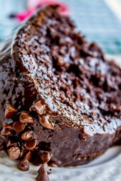 there is a chocolate cake with nuts on it