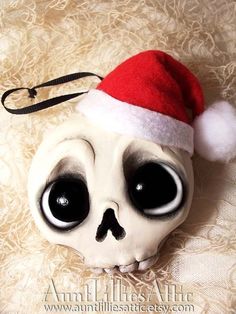 a skull wearing a santa hat on top of a table