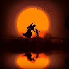 the silhouette of two people holding hands in front of an orange sun with birds flying over them