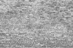 a black and white photo of a brick wall that has been made into a pattern