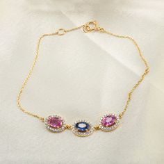 This is a classic-style Chain Link bracelet. A must-have statement piece for every woman. The length of the bracelet can be adjusted, and it is made to fit at 13.5 centimeters wrist size and has an additional loop at 15 centimeters as well. -Material - 18K Solid Yellow Gold -Gemstone - Natural Multi Sapphire & Diamond -Gemstone Weight - 1.5 ct -Gross weight - 2.79 grams People who are spiritually inclined can derive immense benefits from the Blue Sapphire gemstone. The Neelam stone improves meditation, helps in introspection, and self-realization. Therefore blue sapphire is a good companion in the spiritual journey of people. You can also go to my shop Home for more similar bracelets:  https://www.etsy.com/shop/TheJewelVine We offer free resizing, and any customization is welcome. A satisf Gold Oval Bracelet With Gemstone, Formal Birthstone Bracelets, Elegant Cubic Zirconia Bracelet With Birthstone, Elegant Birthstone Bracelets, Elegant Gold Bracelet With Adjustable Oval Chain, Elegant Gold Oval Bracelet With Adjustable Chain, Elegant Round Gemstone Chain Bracelet, Elegant Gold Bracelet With Birthstone, Elegant Diamond Bracelet With Birthstone For Formal Occasions