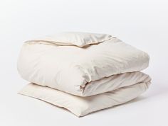 two white pillows stacked on top of each other