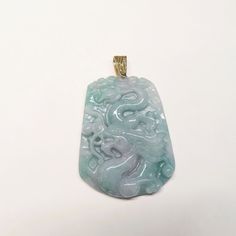 On offer is this beautiful Vintage Chinese Translucent Blue Jadeite Hand Carved Pendant with an exquisite Dragon motif (Year of the Dragon). The Jadeite is translucent with a hint of lavender. This is a large Jadeite pendant measuring 2 inches long x 1.5 inches wide. Overall drop from the top of the gold vermeil (gold wash over sterling silver) bail is 2 1/2 Inches. The Dragon carving is carved in high relief on one side with the reverse side being plain and highly polished. The jadeite has a ve Dragon Carving, Dragon Motif, Carved Dragon, Carved Pendant, Antique Pendant, High Relief, Gold Wash, Dragon Pendant, Lovely Ring