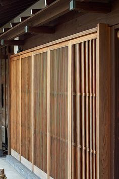 a wooden building with wood slats on the side