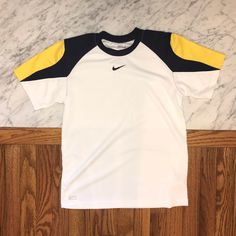 Nwot Authentic Nike “Performance” Kids Shirt. Comfortable And Lightweight. White With Navy Blue And Yellow Accents. No Returns Allowed. Please Ask All Questions Before Purchasing! Yellow Nike T-shirt With Short Sleeves, Nike Yellow Short Sleeve T-shirt, Yellow Short Sleeve Sports Top, Yellow Sporty Shirt For Sports, Yellow Sporty Crew Neck Tops, Sporty Yellow Shirt For Sports, Nike Kids, Yellow Accents, Kids Nike