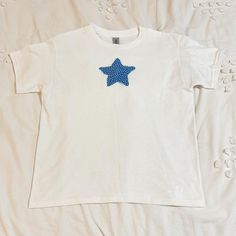 Star Tshirt Fourth Of July Top Blue Star Tee Baby Tee Size Small Brand New, Custom Made By Me Message Me For A Different Size! Fourth Of July Shirt, Graphic T-Shirt, Baby Tee, Fourth Of July Top, Fourth Of July Outfit, Cowboy Boot Tee, America Top, Usa T-Shirt, Red White And Blue Shirt, Flag T-Shirt, Fourth Of July Graphic Tee, Fourth Of July Baby Tee, Fourth Of July Style, Fourth Of July Celebration Shirt, Patriotic Outfit, Usa Shirt, Fourth Of July Vintage Shirt, Fourth Of July Retro Shirt, Fo Summer Cotton T-shirt With Star Patch, Cotton T-shirt With Star Print For Summer, Relaxed Fit Short Sleeve Tops With Star Logo, Cotton Short Sleeve T-shirt With Star Print, Cotton Crew Neck Top With Star Patch, Graphic Tee With Star Logo Short Sleeve, Casual Crew Neck T-shirt With Star Patch, Casual Cotton Tops With Star Logo, Short Sleeve Cotton Top With Star Print