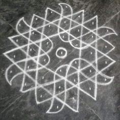 an artistic drawing on the ground with white chalk