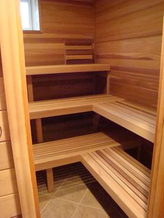 the inside of a sauna with wooden benches