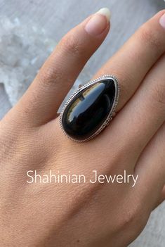 Silver ring with natural black obsidian for women! This ring is a perfect gift idea to the one who loves natural black color of stone and minimalist style) The ring size is adjustable, so you can give a gift without knowing the size! But if you want we can make any size of this ring! Also, we can make matching earrings, pendants, and bracelets! Just message me) Choosing Shahinian Jewelry, you choose the unique design, the best quality, and the perfect look! Ring weight: 10,5 gr ✍️If you have any Black Cabochon Ring As A Gift, Black Cabochon Ring For Gift, Elegant Obsidian Ring Jewelry, Black Obsidian Rings For Gift, Adjustable Obsidian Gemstone Jewelry, Black Teardrop Gemstone Jewelry, Black Sterling Silver Crystal Ring, Nickel Free Black Rings Gift, Black Sterling Silver Open Ring Jewelry