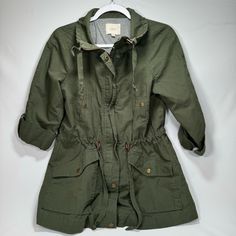 One Of The Best Utility Jackets You Can Find! This Jacket Is In Premium Condition, Worn Once To Possibly Never Worn. The Jacket Features Full Zip And Button Closure, Roll Sleeves Allowing It To Full Or Half Length. Drawstrings At The Collar And Waist Along With Front Pockets In Hand And Ready To Ship! Size: Sp Color: Green Green Button-up Utility Jacket For Winter, Hollow Aesthetic, Green Cotton Button-up Utility Jacket, Fossil Devon Crossbody Bag Green, Olive Cotton Military Style Utility Jacket, Olive Cotton Military Utility Jacket, Roll Sleeves, Military Green Utility Jacket With Button Closure, Safari Outfits