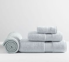 a stack of white towels sitting next to each other