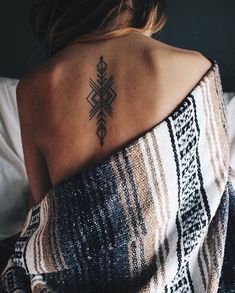 a woman with a tattoo on her back