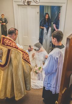 the bride and groom are getting ready to walk down the aisle