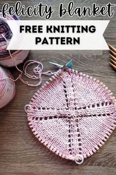 a crocheted basket sitting on top of a wooden table next to yarn and knitting needles