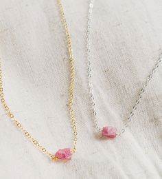 This handcrafted necklace features a raw Pink Tourmaline crystal, known for its ability to heal matters of the heart and inspire feelings of love and happiness. It's also believed to bring peace during times of transformation. Plus, Tourmaline is October's birthstone! Choose from sterling silver or 14k gold fill chains. Average Stone Size: 7x5mm (.27x.19") Modeled Length: 15 Inches Match with our Raw Pink Tourmaline ring here. Spiritual Rose Quartz Gemstone Necklaces, Spiritual Birthstone Necklace With Mineral Crystal, Healing Rose Quartz Gemstone Necklace, Rose Quartz Necklaces With Natural Stones For Healing, Rose Quartz Gemstone Necklaces For Meditation, Rose Quartz Gemstone Necklace For Meditation, Adjustable Pink Birthstone Necklace, Adjustable Spiritual Crystal Birthstone Necklace, Spiritual Birthstone Crystal Necklaces For Everyday