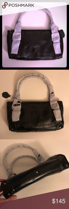 Nwot The Find Black Leather handbag jewel detail Nwot The Find Black Leather handbag jewel detail on handle buckles Mfr handle paper, gen leather tag, and inner stuffing intact, no price tag,  shopnbc featured brand Smaller but still Medium sized handbag, medium handles, more to carry lower arm/hand, would be under armpit if worn on shoulder  Tn7 The Find Bags Black Leather Hobo Bag With Magnetic Closure, Black Rectangular Hobo Bag With Magnetic Closure, Black Hobo Bag With Magnetic Closure Tote Shape, Black Hobo Bag With Magnetic Closure, Black Leather Satchel With Magnetic Closure, Black Hobo Bag With Magnetic Closure For Everyday Use, Luxury Black Hobo Bag With Magnetic Closure, Black Tote Satchel With Magnetic Closure, Black Leather Handbag