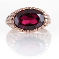 Coconut style Handmade Ring with Oval Garnet in 14K Rose Gold. Vintage style, statement ring that can match any outfit.► 14 Karat Rose Gold► Size 7.25► Total Weight 6.99 gr► Oval Garnet Stone 16x12All items are Handmade, I pay a lot of attention for every detail in the jewelry I design.All of my items are hand crafted in Kisufim's Designer jewelry Store in Tel Aviv, and shipped direct to customers all over the world. I am proud to say that many celebrities, models and stars across the world wear Elegant Faceted Ruby Ring For Formal Occasions, Elegant Formal Faceted Ruby Ring, Formal Rose Gold Ruby Ring, Elegant Ruby Signet Ring For Formal Occasions, Elegant Red Signet Ring For Formal Occasions, Elegant Faceted Ruby Promise Ring, Elegant Ruby Signet Ring With Hallmark, Elegant Red 14k Gold Signet Ring, Formal Faceted Rose Gold Rings