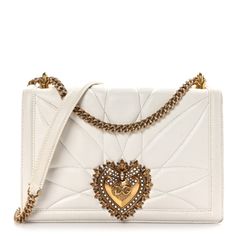 This is an authentic DOLCE & GABBANA Calfskin Large Devotion Crossbody Bag in White. This chic bag is crafted of luxuriously smooth calfskin leather. The bag features a polished gold chain-link shoulder strap with a leather shoulder pad and a facing magnetic snap closure that is embellished with a golden heart of faux pearls and metal. The flap opens to a white leather interior with card slots. Designer White Calf Leather Shoulder Bag, Luxury White Calf Leather Shoulder Bag, Luxury White Calf Leather Bag, Luxury White Soft Leather Bag, Luxury White Bags With Leather Lining, Everyday Luxury White Bags With Leather Lining, Golden Heart, Chic Bags, Purple Bags