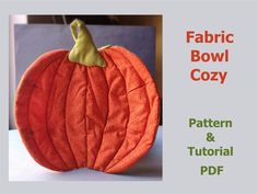 a paper pumpkin with the words fabric bowl cozy on it's front and side