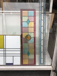 an assortment of stained glass panels on display