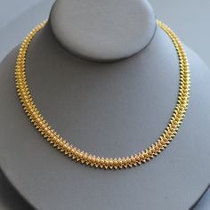 "A stunning antique Victorian Etruscan Revival period (1860-1880) fancy woven 18k yellow gold necklace. This beautiful antique necklace is wrought with amazing tiny details like woven gold lace and even the clasp is embellished. It is weighty and the same width throughout with a nice slinky feel that feels great when worn and retains it's original secure clasp and safety chain. Hallmarked for 18k gold. Chain length approximately : 16.75\" Chain width approximately: 8.75mm Weight: 26.4g This piec Gold Plain Necklace, Plain Chain Designs Gold, Antique Choker Designs Gold, Short Chains Gold, Plain Gold Necklace Designs, Thushi Necklace Gold, Short Necklace Designs Gold, Gold Short Necklace Designs, Simple Gold Necklace Designs